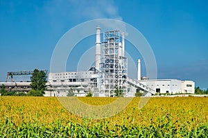 Industrial landscape environmental pollution waste of cement factory. Big pipes of industry enterprise plant. lime and chalk