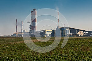 Industrial landscape environmental pollution waste of thermal power plant. Big pipes of chemical industry enterprise plant