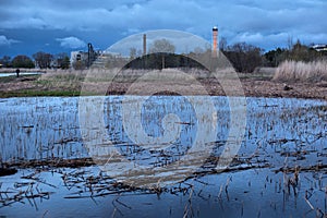 Industrial landscape near Parnu bay in evening. It a bay in the northeastern part of the Gulf of Livonia Gulf of Riga, in