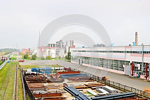 Industrial landscape. Panoramic view of technological pipes. Rusty pipes, blue rubies, production communications. Repair buildings