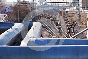 Industrial landscape with pipes and railway lines