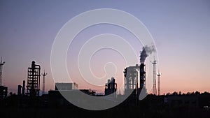 Industrial landscape, the pipes of the thermal power plant at sunset.