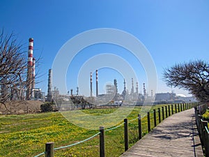Industrial landscape with plant factory chimneys and beautiful spring nature landscape, Portugal