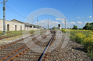 Railroad - rails, rubble. High voltage transmission lines