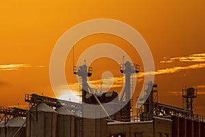 Industrial landscape at sunset time, stopped factory
