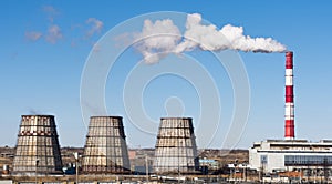 Industrial landscape. Thermal power plant with smoking chimneys.