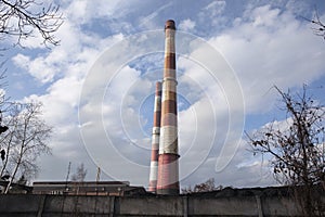 Industrial landscape with two red and white industrial chimneys. Coal mine in Katowice, Poland.