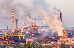 Industrial landscape in Ukraine. Steel factory at sunset. Pipes with smoke. Metallurgical plant. steelworks, iron works