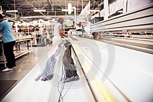 Industrial landscape with wire on a machine at a modern plant for the production of wiring for automobiles