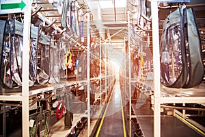 Industrial landscape with wire racks in a modern plant for the production of electric wiring for automobiles. Logistics