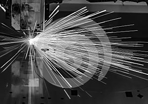 Industrial Laser cutting processing manufacture technology of flat sheet metal steel material with sparks