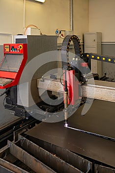 Industrial laser or plasma cutting processing manufacture technology of flat metal sheet. steel material with sparks