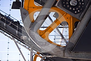 Industrial Linkage with orange trams flywheel with protective me
