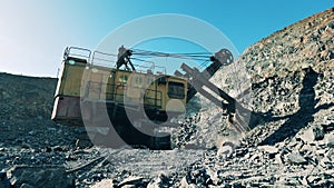 Industrial machine is excavating ore in the minery