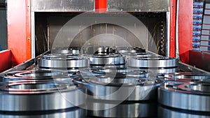 Industrial and machinery concept. A tecnological part of bearing production and assembling. Conveyor in bearing factory