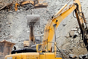 Industrial machinery on highway construction site, heavy duty excavator