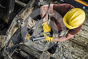 Industrial Machinery Technician with Hand Pump Grease Gun