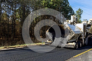 Industrial machinery working with asphal industrial laying fresh asphalt