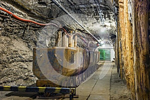 Industrial metal wagon in underground tunnel