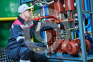 Industrial oil service and mantenance. industrial worker operates oil purification machine