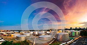 Industrial oil tanks in a refinery at twilight