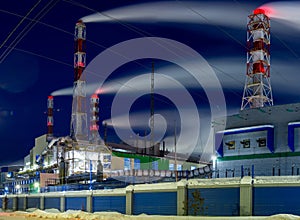 Industrial panorama with a factory and pipes
