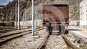 Industrial panorama view of the back of a brown vagon covered wi