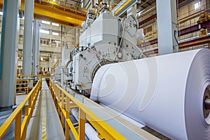 Industrial paper production line with machinery at work