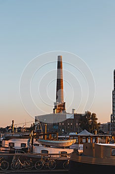 Industrial part of Ghent in the Dampoort district during sunset. Belgian industrial city. Factory industry. Chimneys and factories