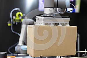 Industrial pick and place robotic or robot arm for cardboard box packing