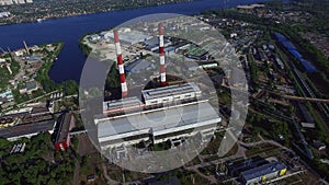 Industrial pipe on power plant in city. Aerial view industrial district in city