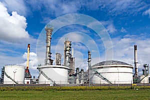 Industrial pipelines and silos at an oil refinery plant