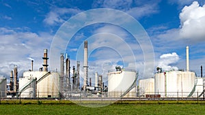 Industrial pipelines and silos at an oil refinery plant