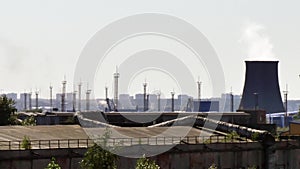 Industrial pipes of plant chimney smoke.