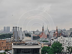 Industrial pipes rising before the Kremlin\'s towers