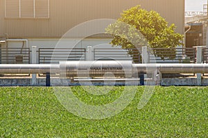 Industrial pipes of steam high pressure beside the road in indus