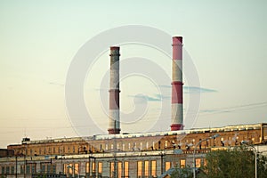 Industrial plant with exhaust pipes