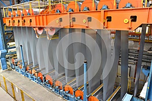 Industrial plant for the production of sheet metal in a steel mill