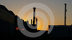 Industrial plant at sunset, silhouettes and light 2