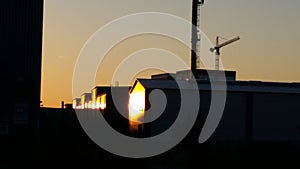 Industrial plant at sunset, silhouettes and light 3