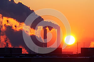 Industrial pollution at sunset