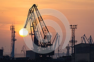 Industrial port dockyard with sunset