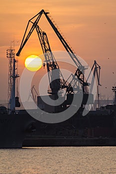 Industrial port dockyard with sunset in Portrait