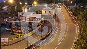 Industrial port in the evening - the road and railway for deliver goods to the ships for transportation by sea