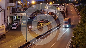 Industrial port in the evening - the road and railway for deliver goods to the ships for transportation by sea