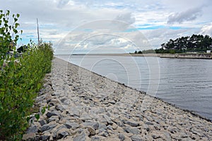 Industrial port Lubmin with fairway and quay under a cloudy sky, here is the landfall of the natural gas pipeline nord stream