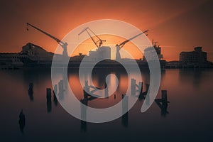 Industrial port with ship and cranes in Zorrozaurre