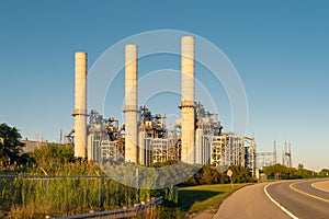 Industrial power generation facility at sunset