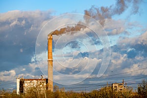 Industrial power plant with smokestack.