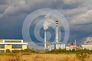 Industrial power plant with smokestack